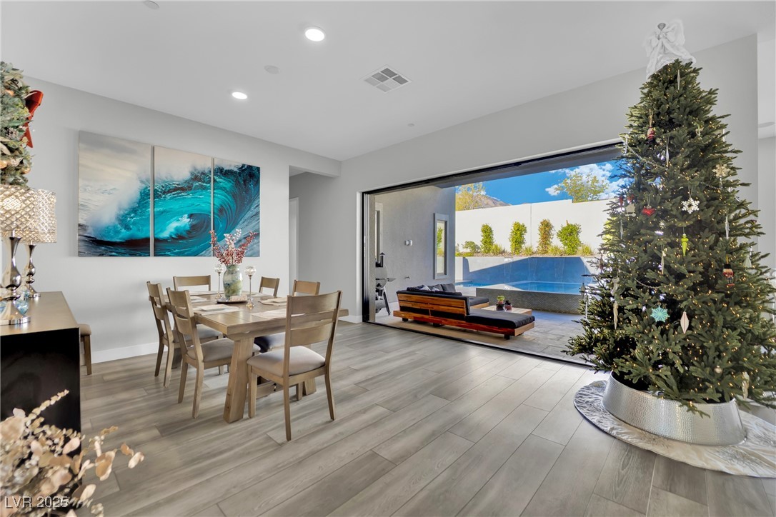 397 Highview Rdg Avenue Las Vegas, NV 89138 - Photo 31 of 97 Dining area featuring light wood-type flooring and recessed lighting