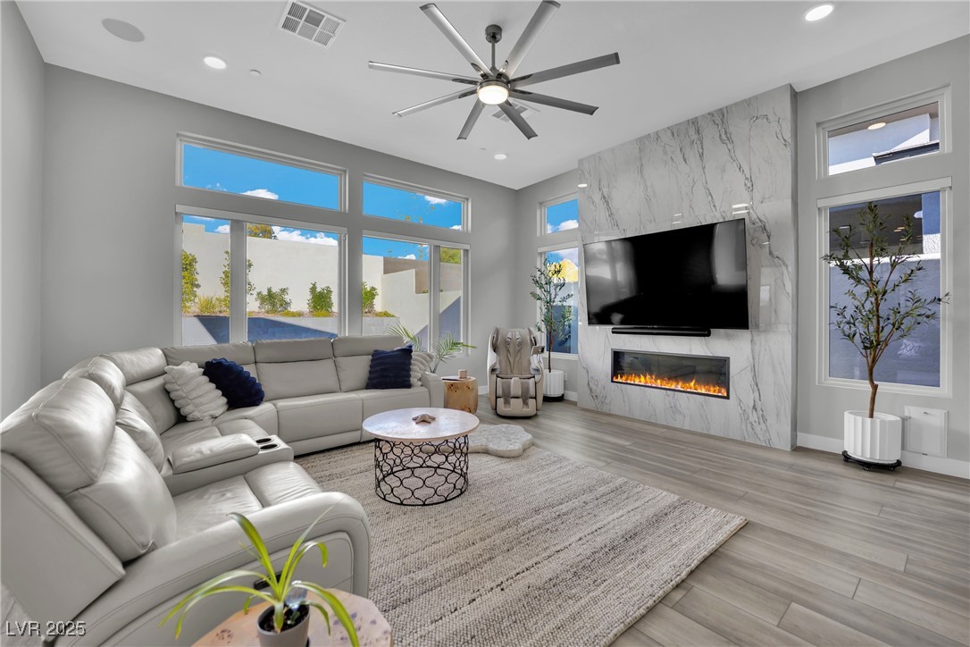 397 Highview Rdg Avenue Las Vegas, NV 89138 - Photo 48 of 97 Living area featuring ceiling fan, light wood-style floors, a high end fireplace, and recessed lighting