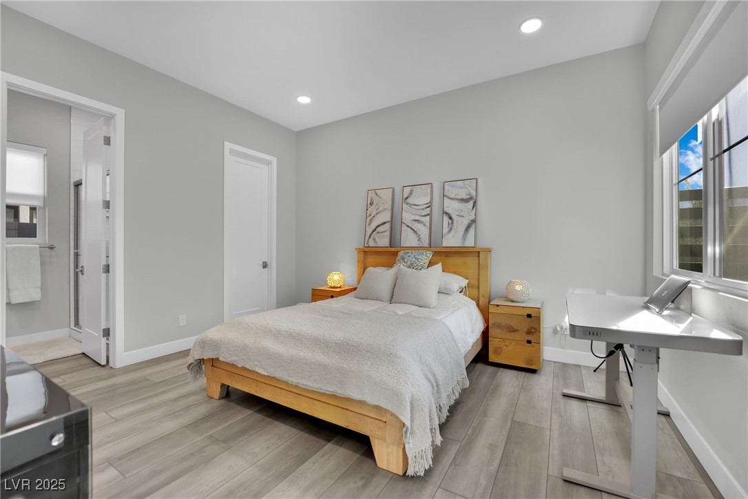 397 Highview Rdg Avenue Las Vegas, NV 89138 - Photo 53 of 97 On suite Bedroom with light wood finished floors and recessed lighting