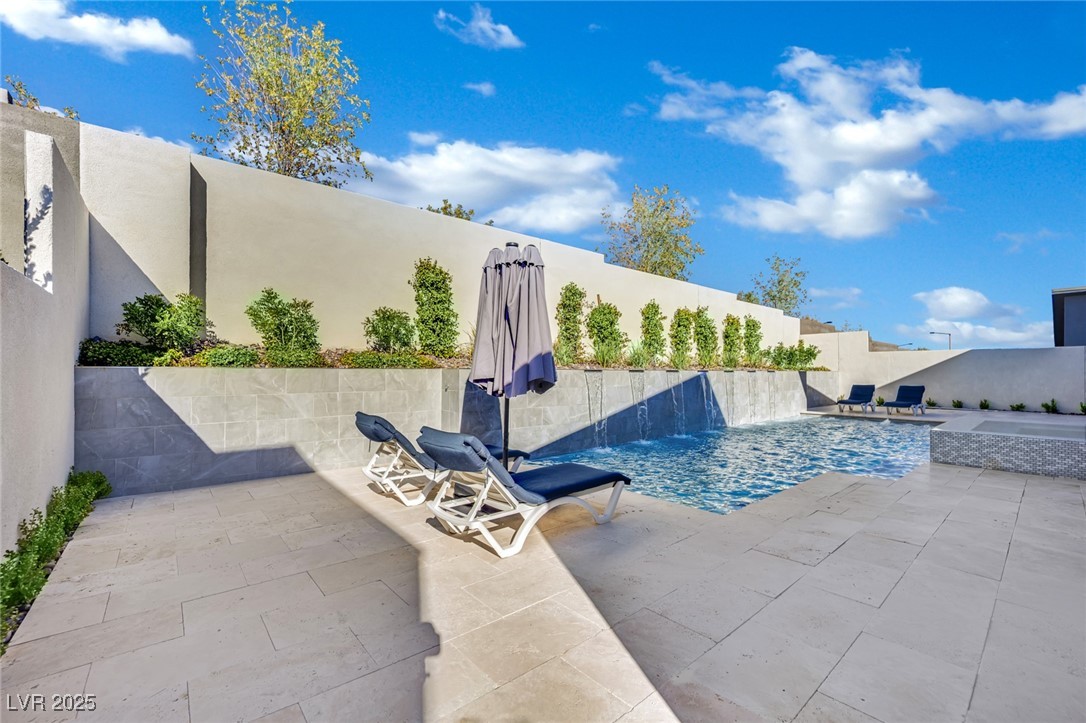 397 Highview Rdg Avenue Las Vegas, NV 89138 - Photo 6 of 97 View of pool with a patio area and a fenced backyard