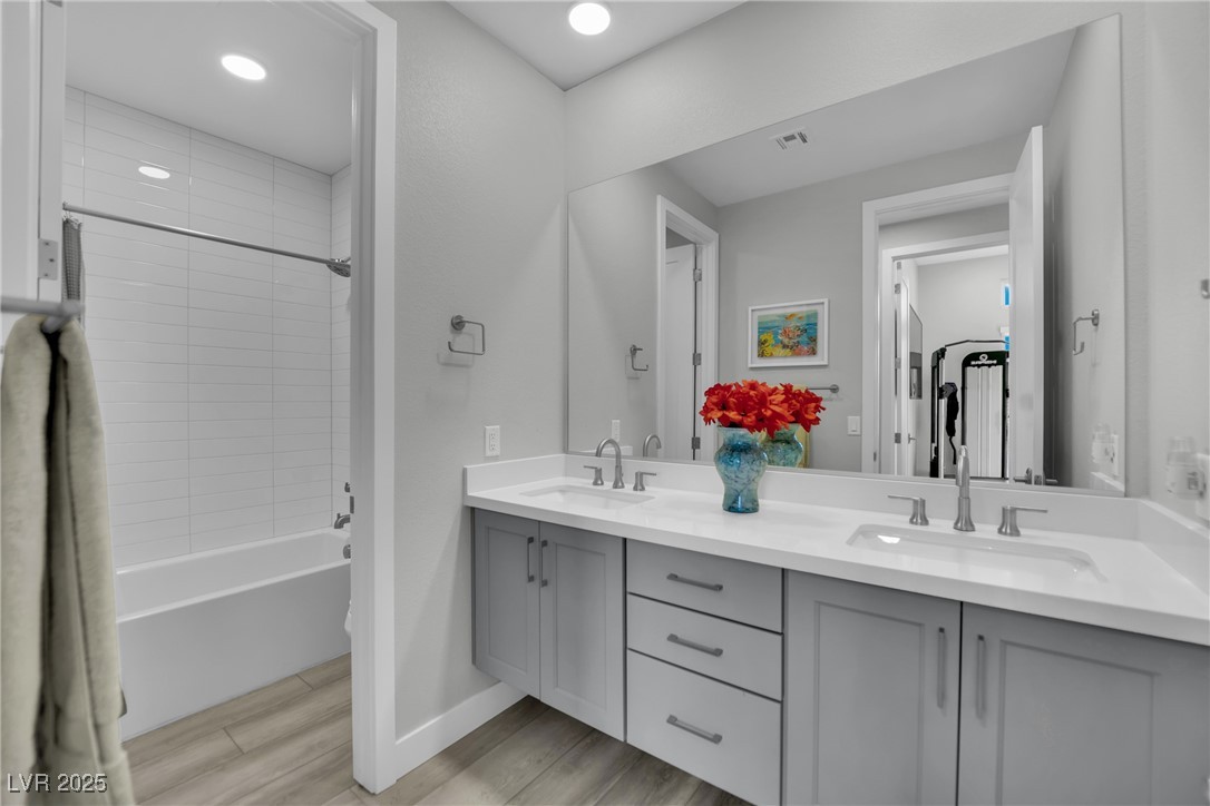 397 Highview Rdg Avenue Las Vegas, NV 89138 - Photo 61 of 97 Full bathroom with double vanity, wood finish floors, shower / washtub combination, and recessed lighting