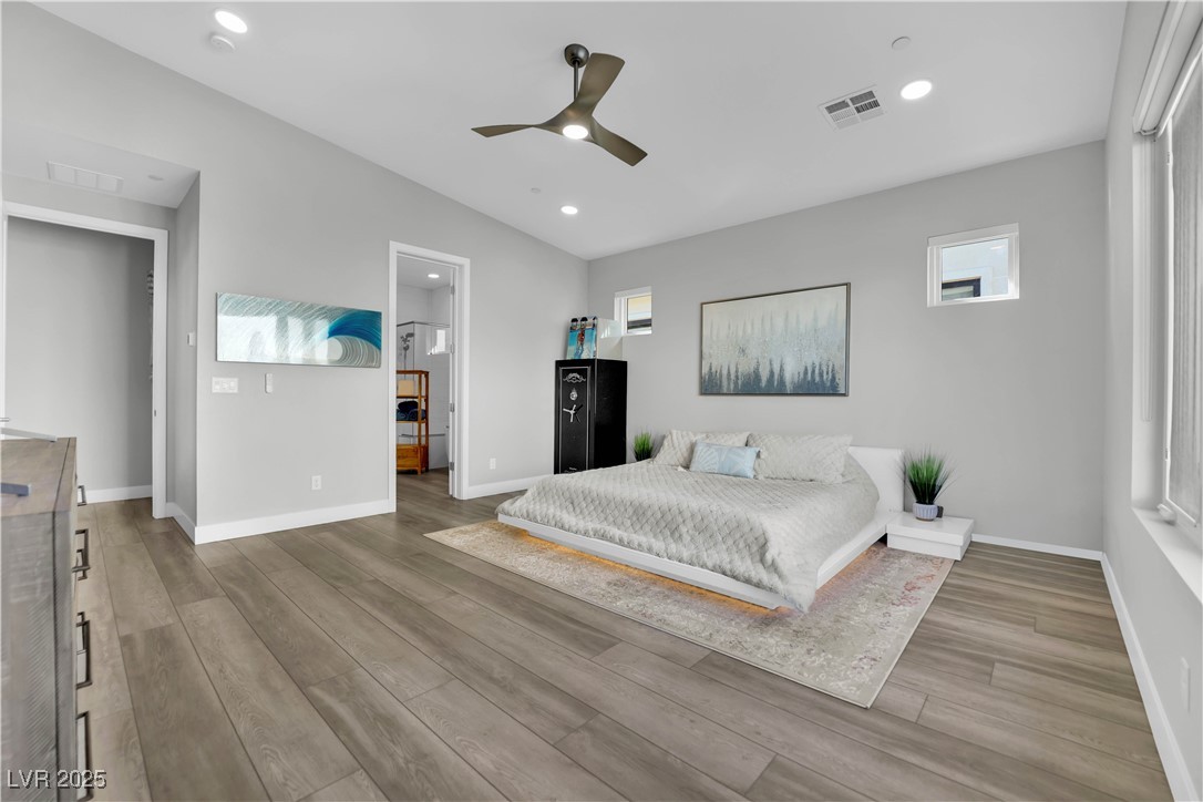 397 Highview Rdg Avenue Las Vegas, NV 89138 - Photo 65 of 97 Bedroom with ceiling fan, multiple windows, light wood finished floors, and recessed lighting