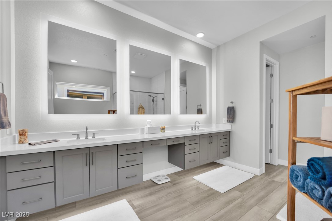 397 Highview Rdg Avenue Las Vegas, NV 89138 - Photo 66 of 97 Bathroom with double vanity, wood finish floors, a shower stall, and recessed lighting