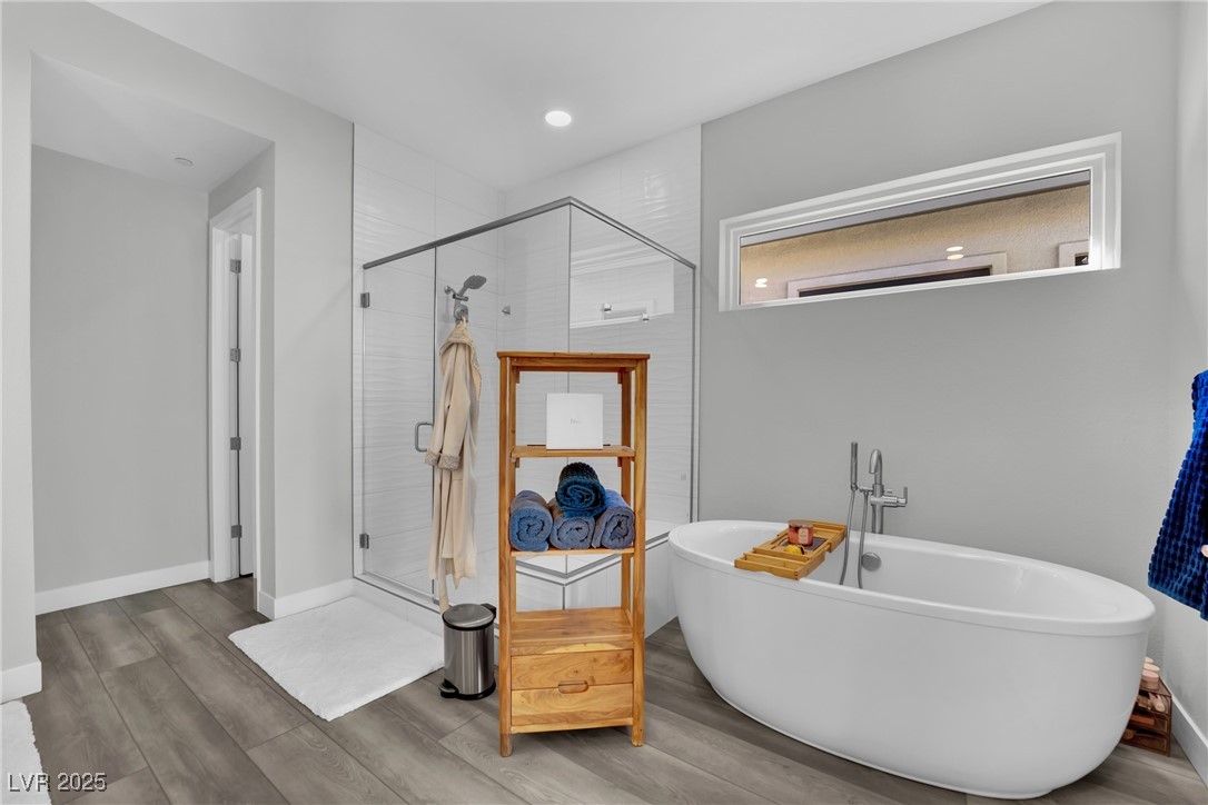 397 Highview Rdg Avenue Las Vegas, NV 89138 - Photo 67 of 97 Bathroom with a soaking tub, wood finished floors, a shower stall, and recessed lighting