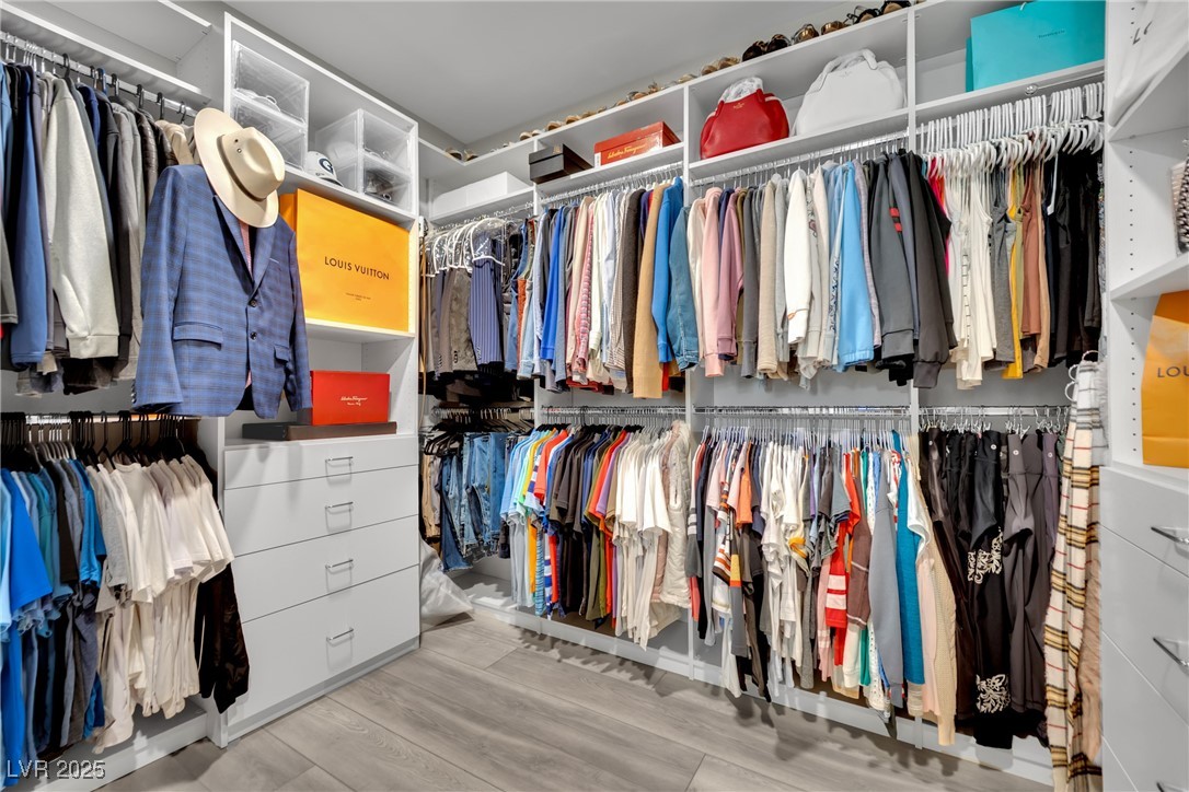 397 Highview Rdg Avenue Las Vegas, NV 89138 - Photo 69 of 97 Walk in closet with light wood-type flooring