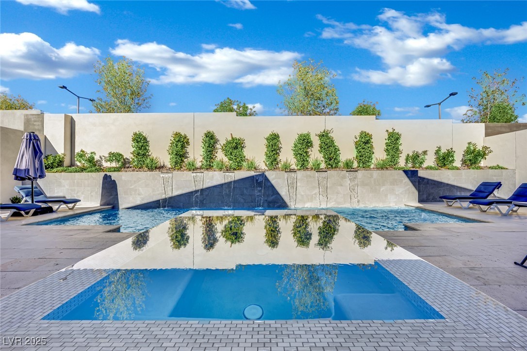 397 Highview Rdg Avenue Las Vegas, NV 89138 - Photo 8 of 97 View of swimming pool featuring a patio area and a fenced backyard
