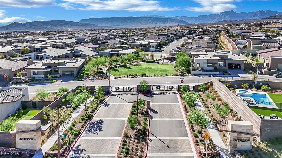 397 Highview Rdg Avenue Las Vegas, NV 89138 - Photo 87 of 97 Aerial perspective of suburban area with mountains and property parcel outlined