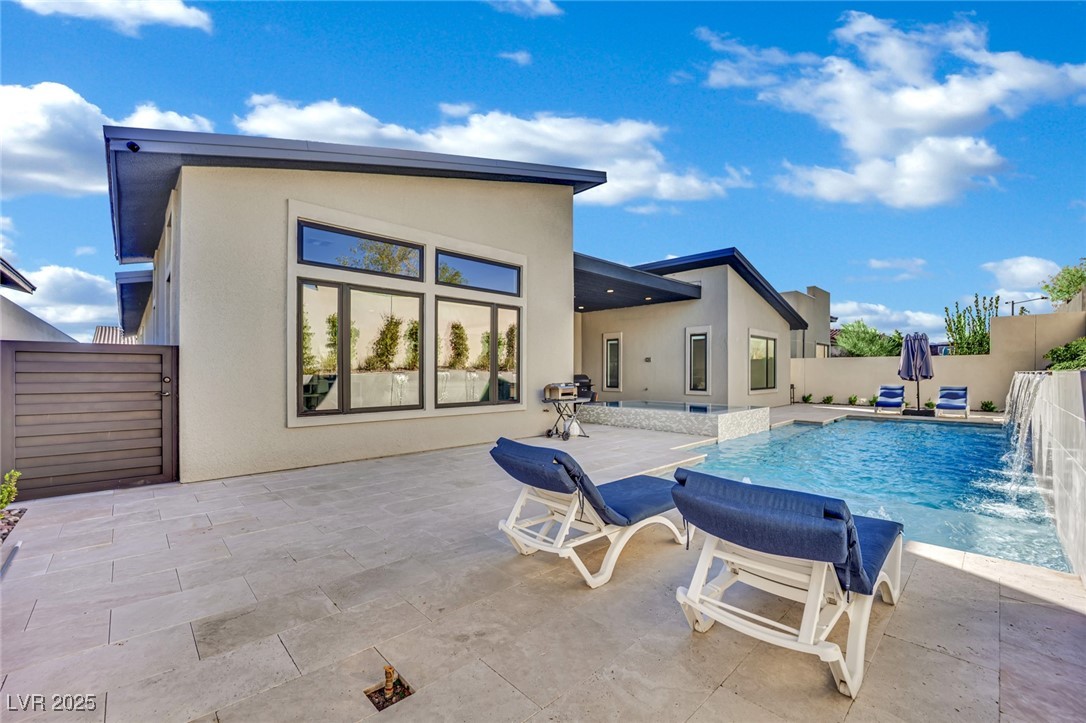 397 Highview Rdg Avenue Las Vegas, NV 89138 - Photo 10 of 97 View of swimming pool with a fenced backyard and a patio