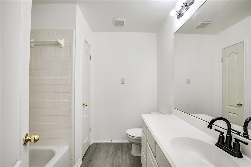 3524 Bratton Ridge Crossing Austin, TX 78728 - Photo 13 of 16 a bathroom with a sink a toilet and bathtub