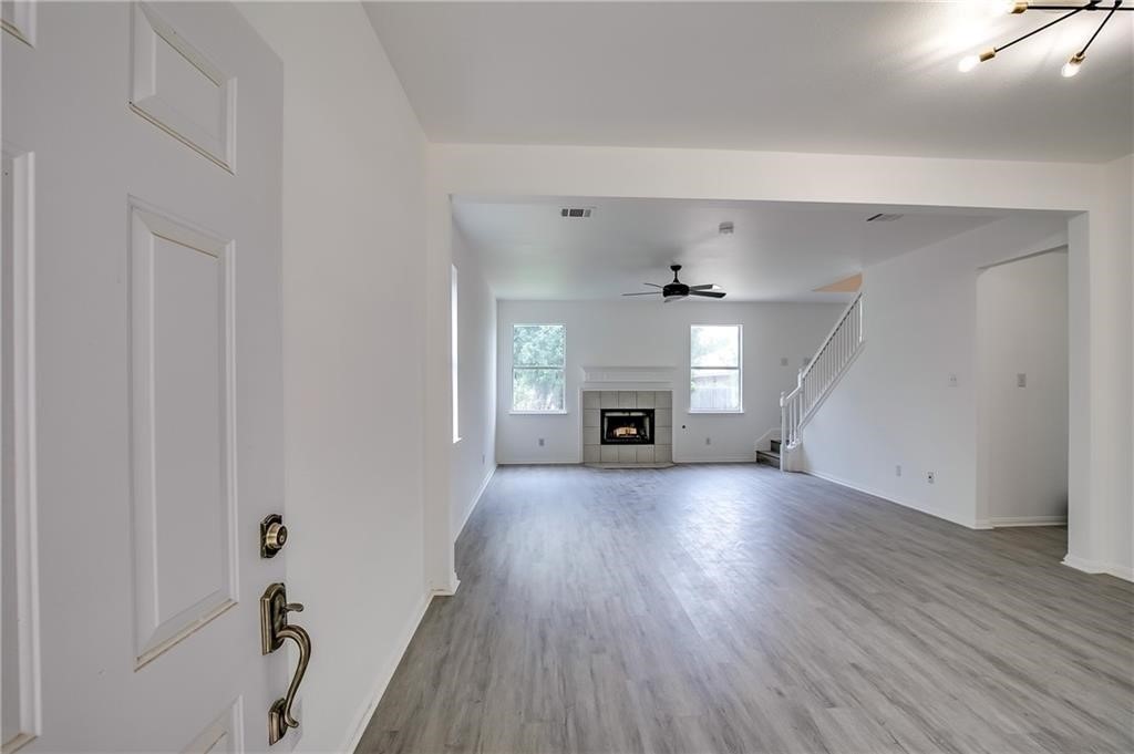 3524 Bratton Ridge Crossing Austin, TX 78728 - Photo 2 of 16 a view of empty room with wooden floor