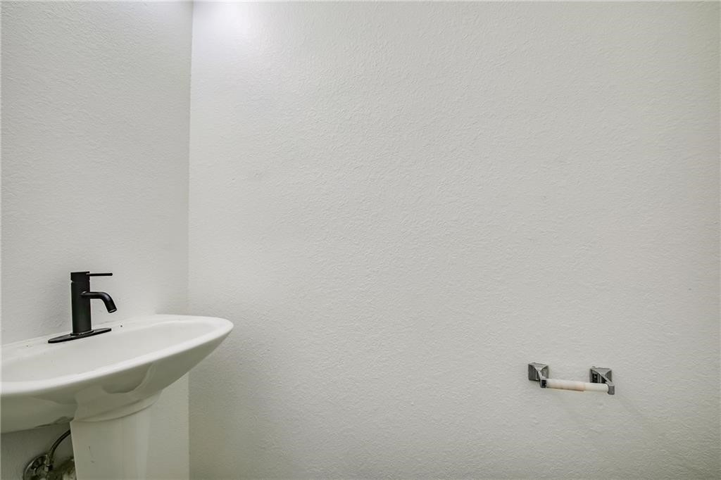 3524 Bratton Ridge Crossing Austin, TX 78728 - Photo 7 of 16 a bathroom with a sink and mirror