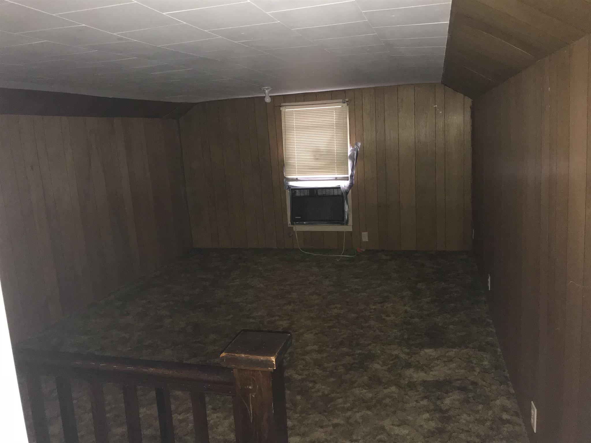 Upstairs room #2 used as a bedroom (no closet)