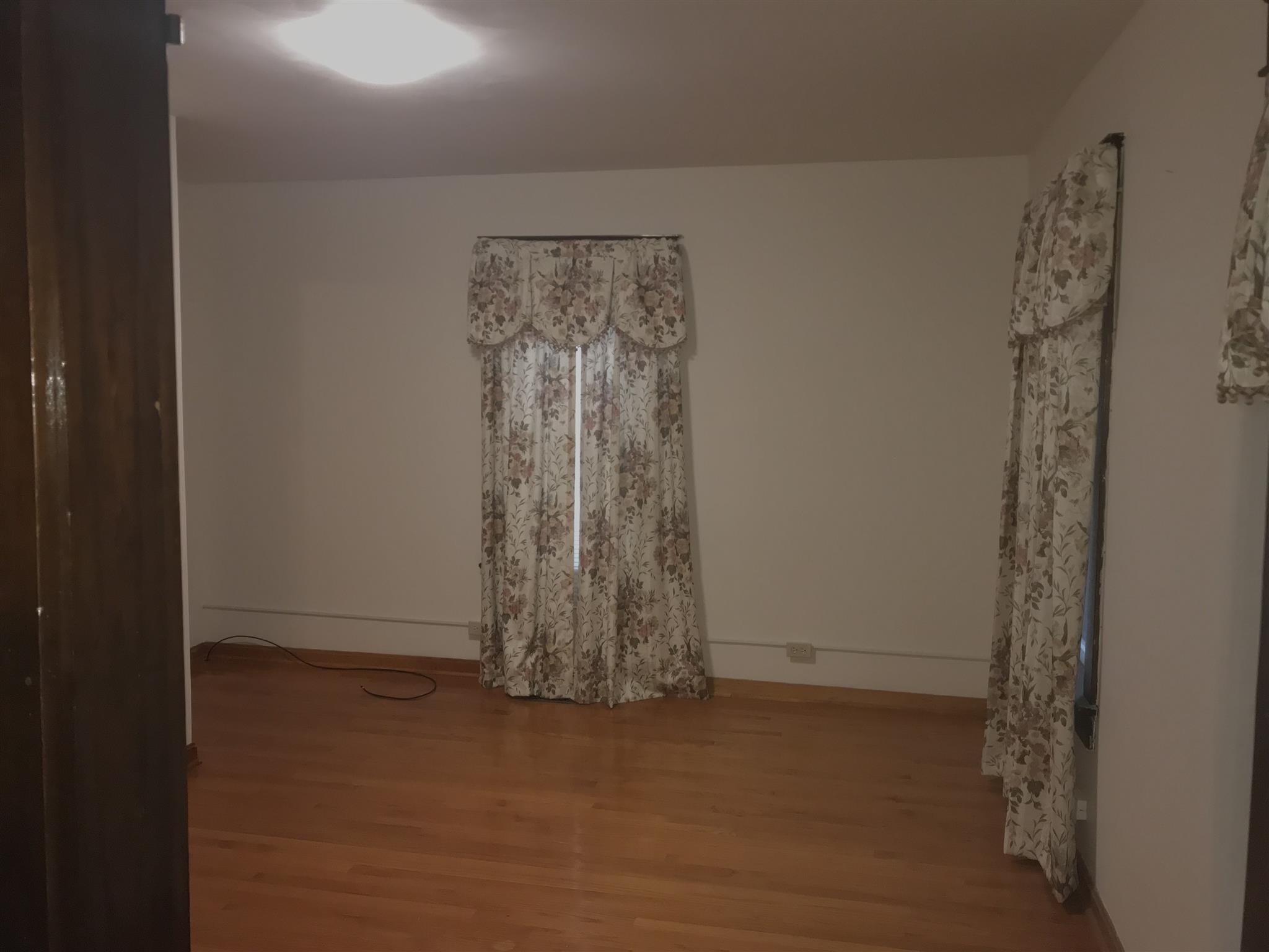 Bedroom  with hardwoods