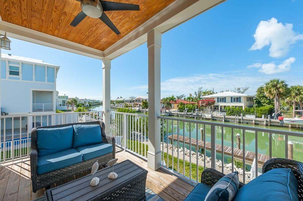 217 Sombrero Beach Road, Unit 2 Marathon, FL 33050 - Photo 7 of 23 Coffee on the deck over the water
