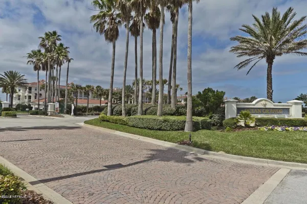 a view of a yard with palm trees