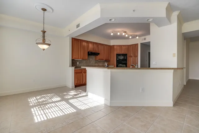 a view of a kitchen with a sink cabinets and window