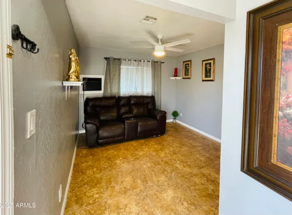 a living room with furniture window and a flat screen tv