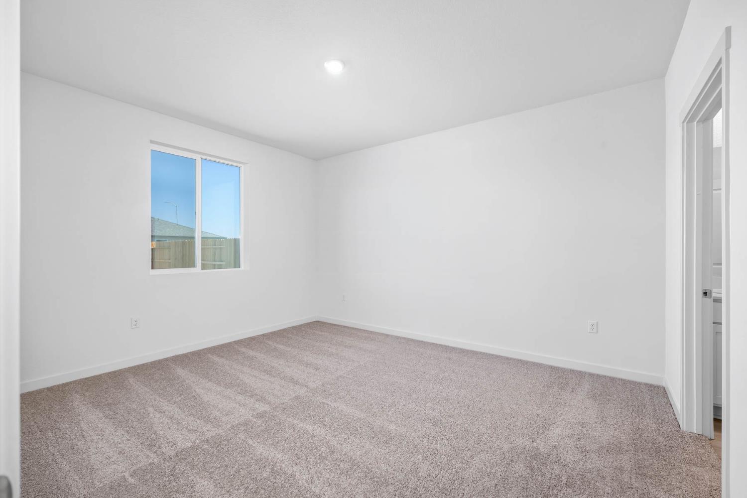3077 Isley Way Stockton, CA 95212 - Photo 9 of 10 an empty room with a window