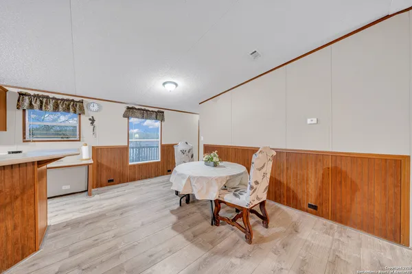 a kitchen with stainless steel appliances a stove a sink and a refrigerator