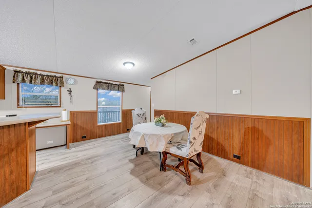 a kitchen with stainless steel appliances a stove a sink and a refrigerator