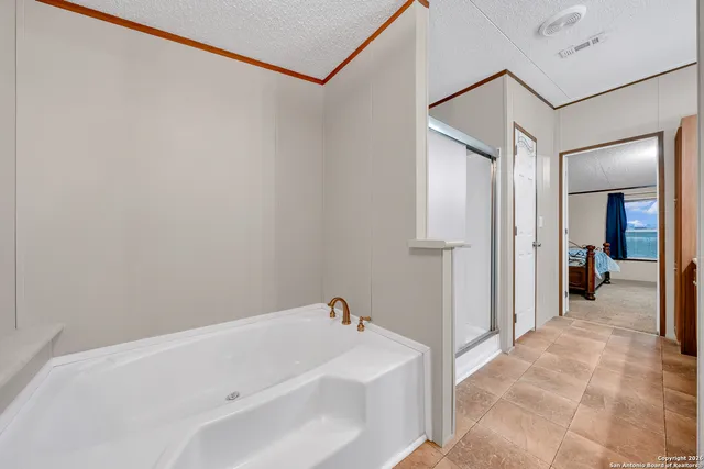a bathroom with a bathtub and a shower