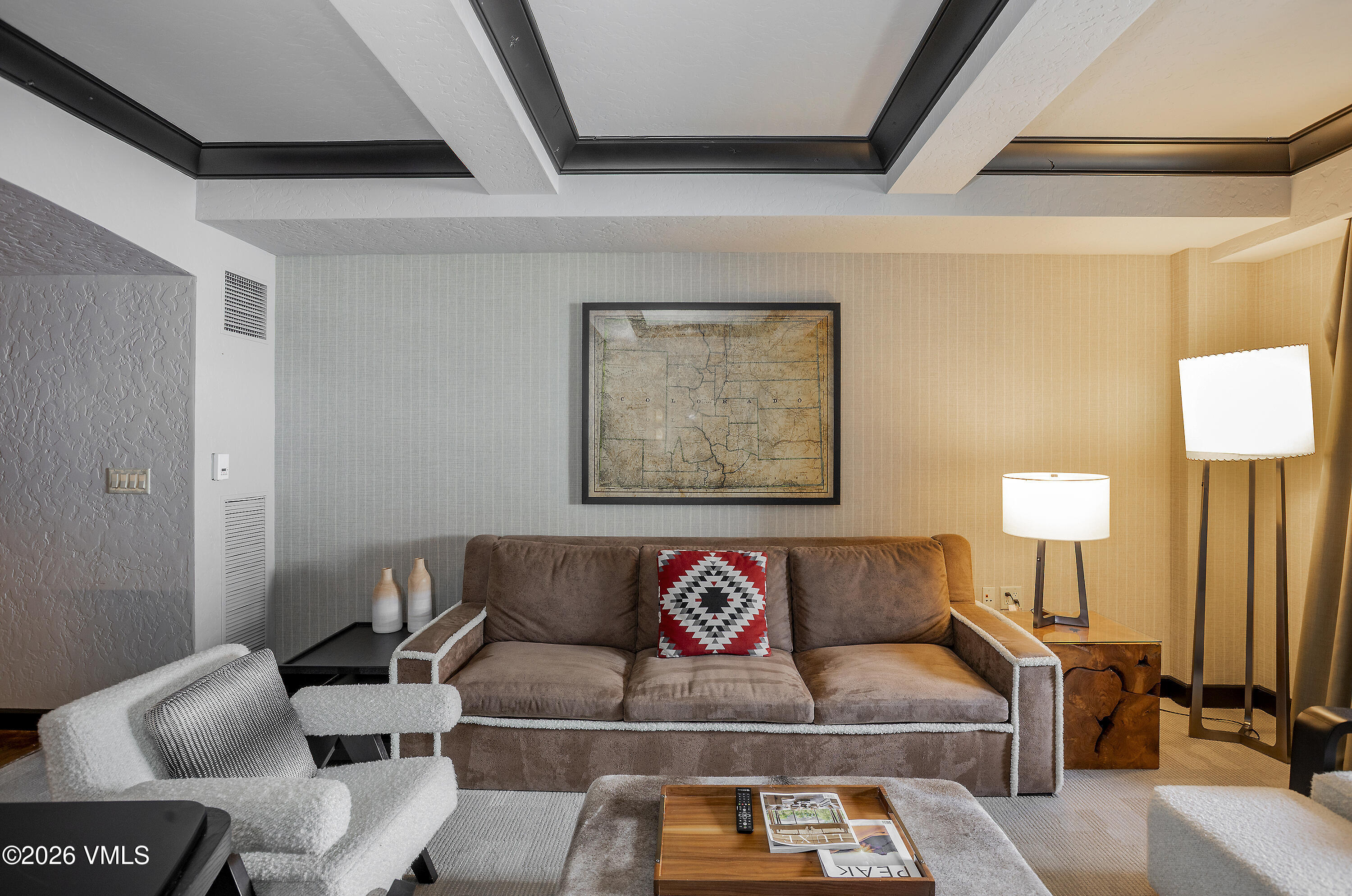 130 Daybreak Ridge Road, Unit HS640 Avon, CO 81620 - Photo 14 of 54 a living room with furniture and a lamp