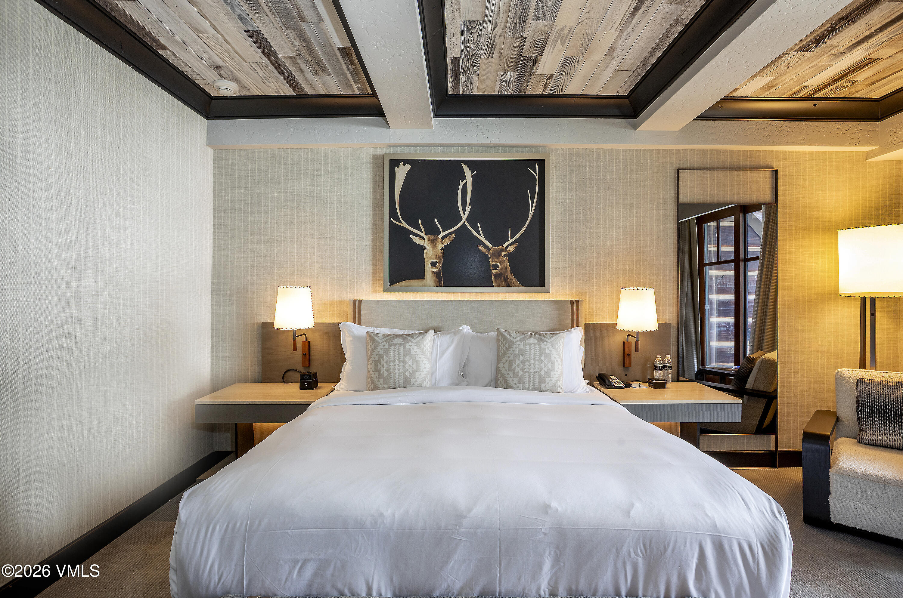 130 Daybreak Ridge Road, Unit HS640 Avon, CO 81620 - Photo 18 of 54 a bedroom with a bed and a painting on the wall