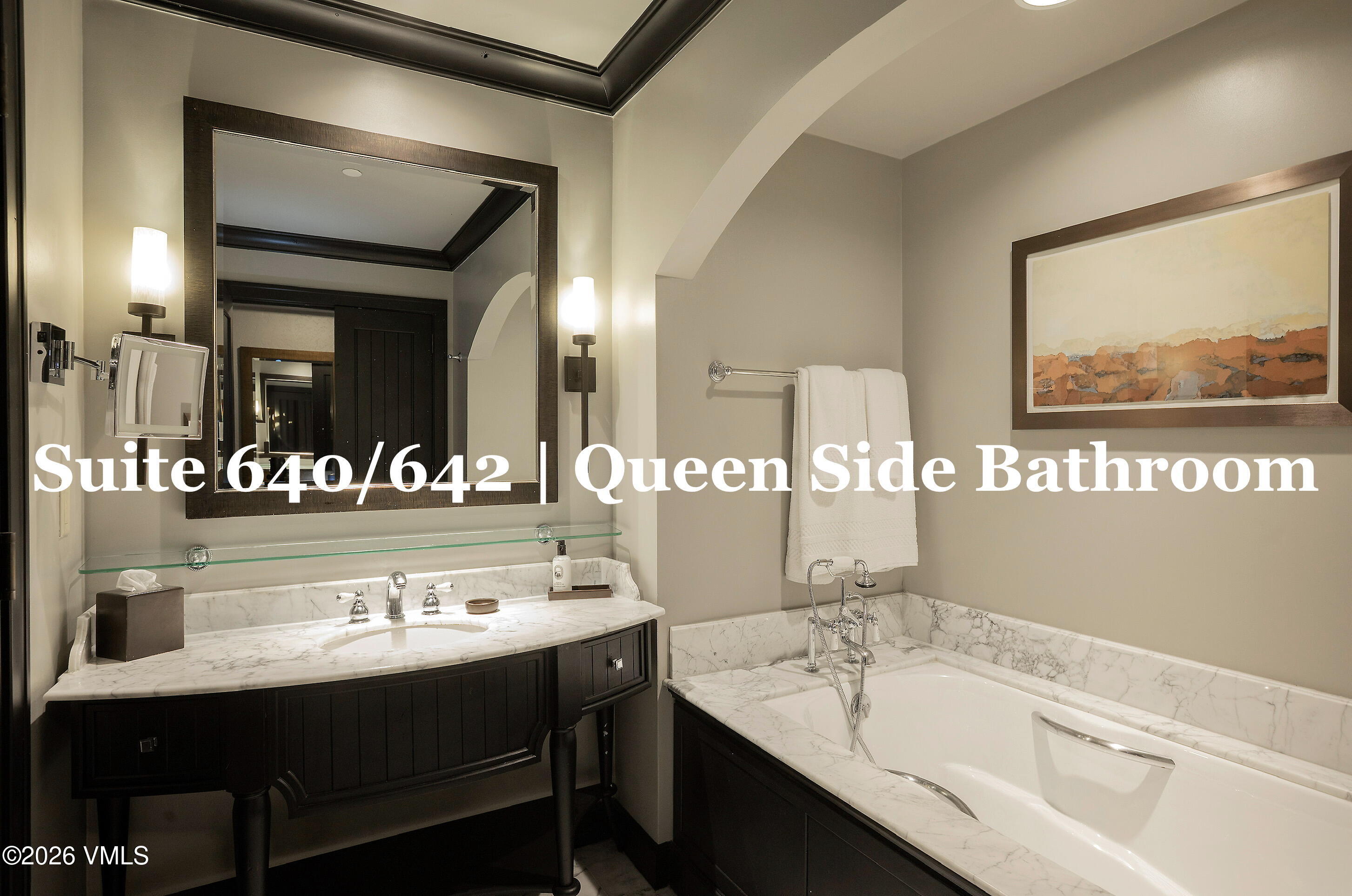 130 Daybreak Ridge Road, Unit HS640 Avon, CO 81620 - Photo 39 of 54 a bathroom with a sink a mirror and a bathtub