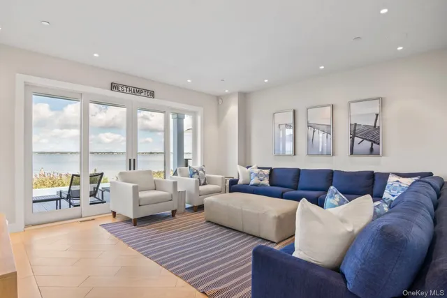 a dining hall with stainless steel appliances a dining table and chairs