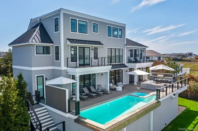 a view of a yard with furniture and lounge chair