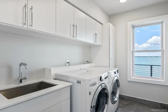 a view of balcony with furniture and umbrella