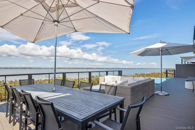 a view of a patio with table and chairs