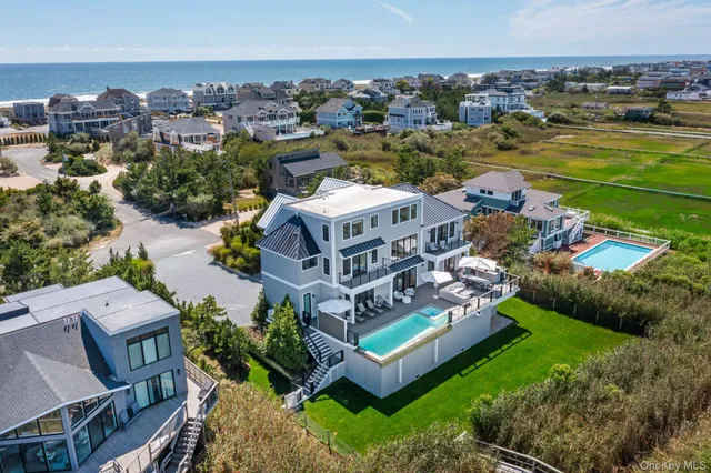 an aerial view of a house with outdoor space