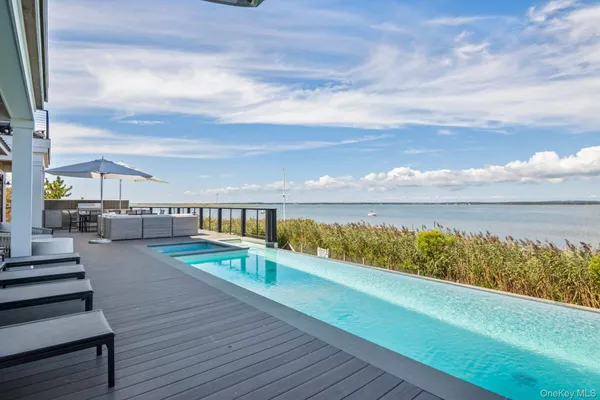 a view of swimming pool with outdoor seating
