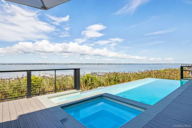a view of swimming pool with an outdoor seating