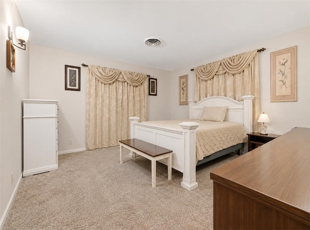 9675 County Road 325 Mathis, TX 78368 - Photo 25 of 29 a bedroom with a bed and a table