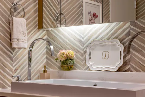 a living room with furniture kitchen view and a flat screen tv