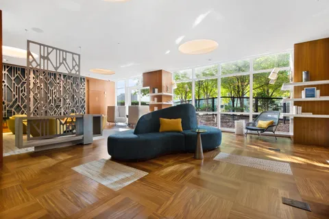 a lobby with furniture and stairs