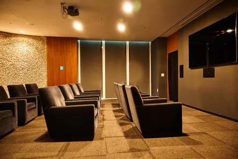 a room with gym equipment and a large window