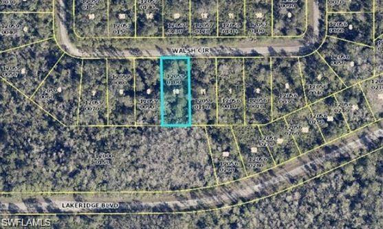 381 Walsh Circle Lehigh Acres, FL 33920 - Photo 2 of 3 a view of a yard with wooden stairs