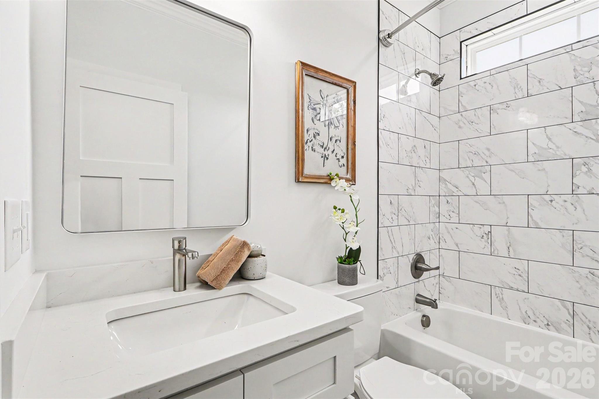 4115 Miller Road Salisbury, NC 28147 - Photo 21 of 26 a bathroom with a sink a toilet and shower