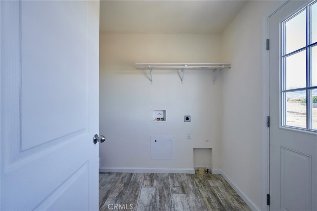 12012 Lager Road Phelan, CA 92371 - Photo 14 of 35 a view of a room with wooden floor closet and windows