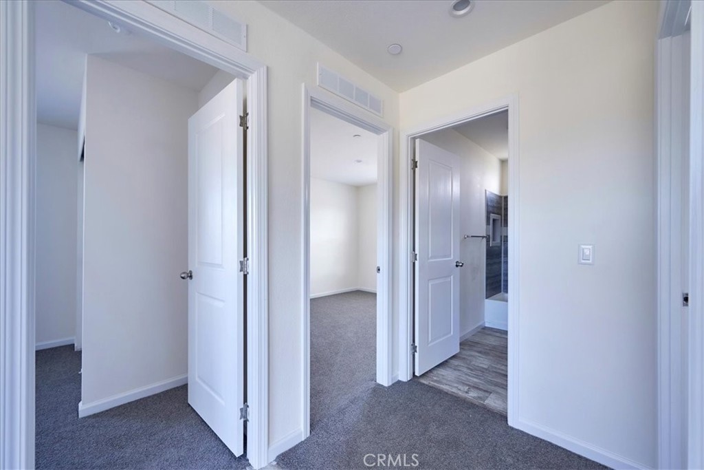 12012 Lager Road Phelan, CA 92371 - Photo 23 of 35 a view of a hallway with wooden floor