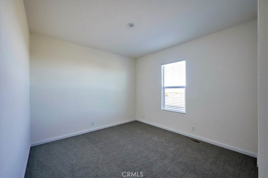 12012 Lager Road Phelan, CA 92371 - Photo 24 of 35 an empty room with a window