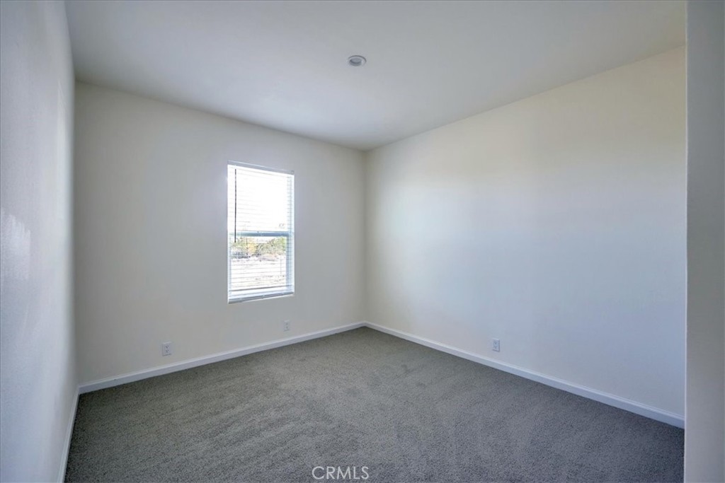 12012 Lager Road Phelan, CA 92371 - Photo 29 of 35 an empty room with a window