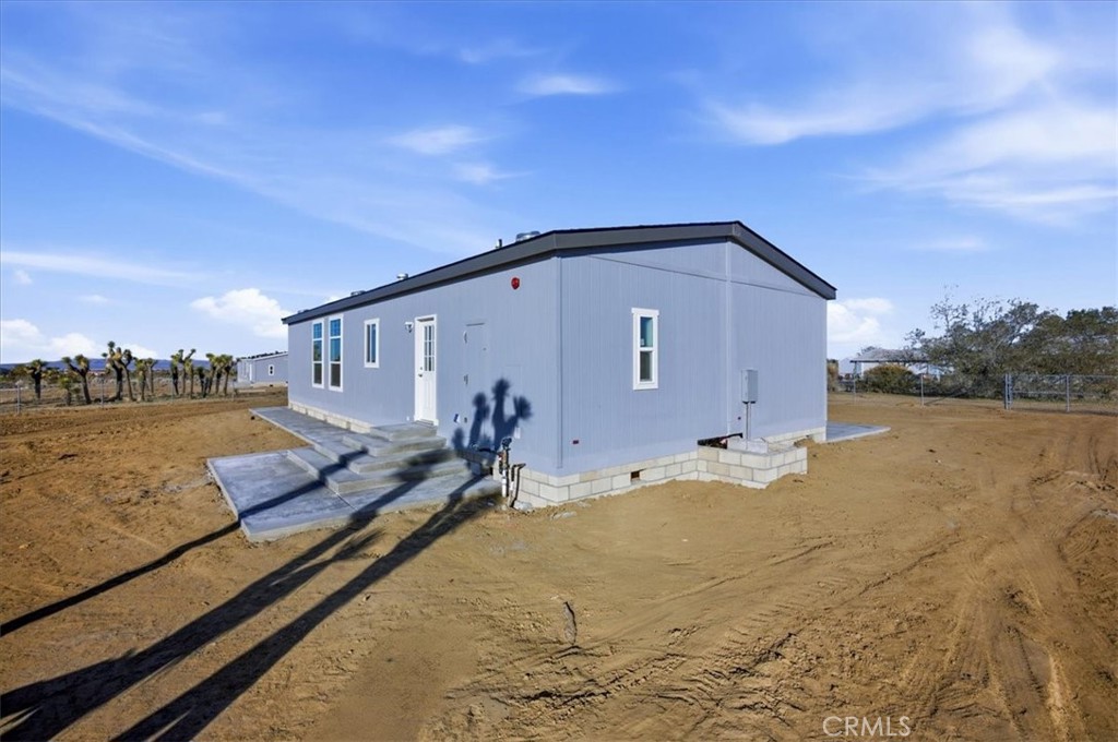 12012 Lager Road Phelan, CA 92371 - Photo 31 of 35 a view of a house with a yard