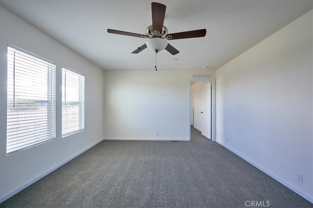 12012 Lager Road Phelan, CA 92371 - Photo 7 of 35 a view of room with window and ceiling fan