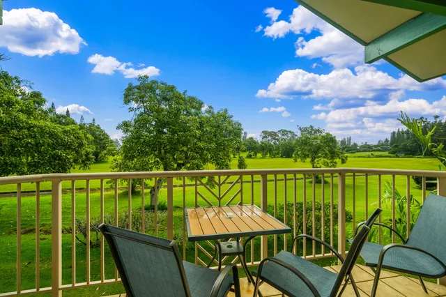 a view of a balcony with furniture