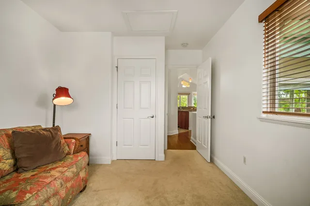 a bed room with a bed and a window