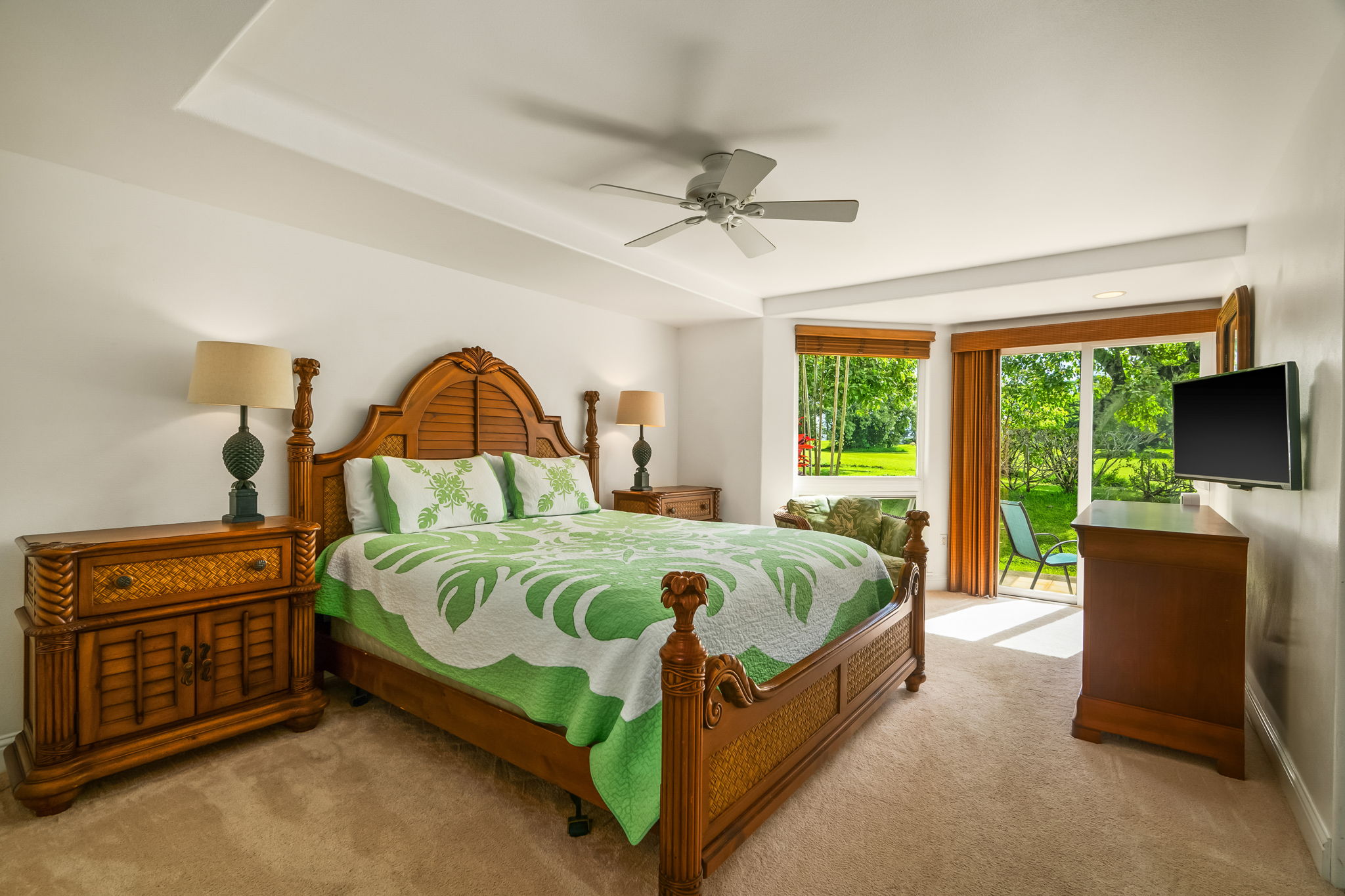 4141 Lei O Papa Road, Unit 6 Princeville, HI 96722 - Photo 15 of 26 a bed sitting in a bedroom next to a window